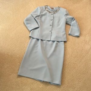 Kasper lt. blue skirt suit w/crystal buttons and collar embellishment. Size 10.